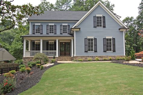 blue siding with black shutters.